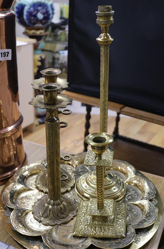 A copper jug, a brass towel rail and a pair of candlesticks